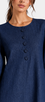 Mahaute Ikavy navy blue midi dress with puff sleeves, 3D floral cuffs, and decorative front buttons.