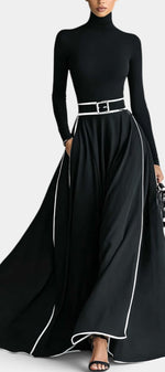 Robe longue Mahaute Inmaculada à col roulé, manches longues et finitions contrastées en noir, élégante et sophistiquée.