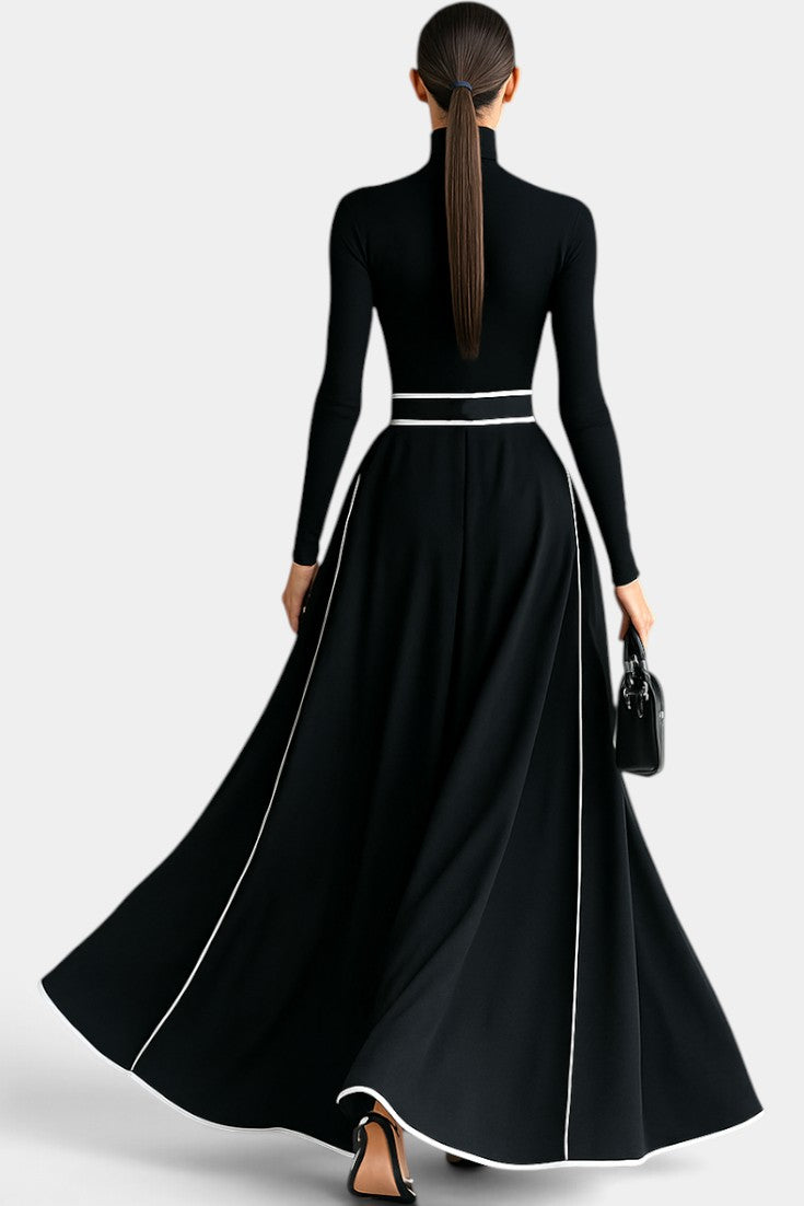 Robe longue noire Mahaute Inmaculada à col roulé, manches longues et finitions contrastées, élégante et sophistiquée.
