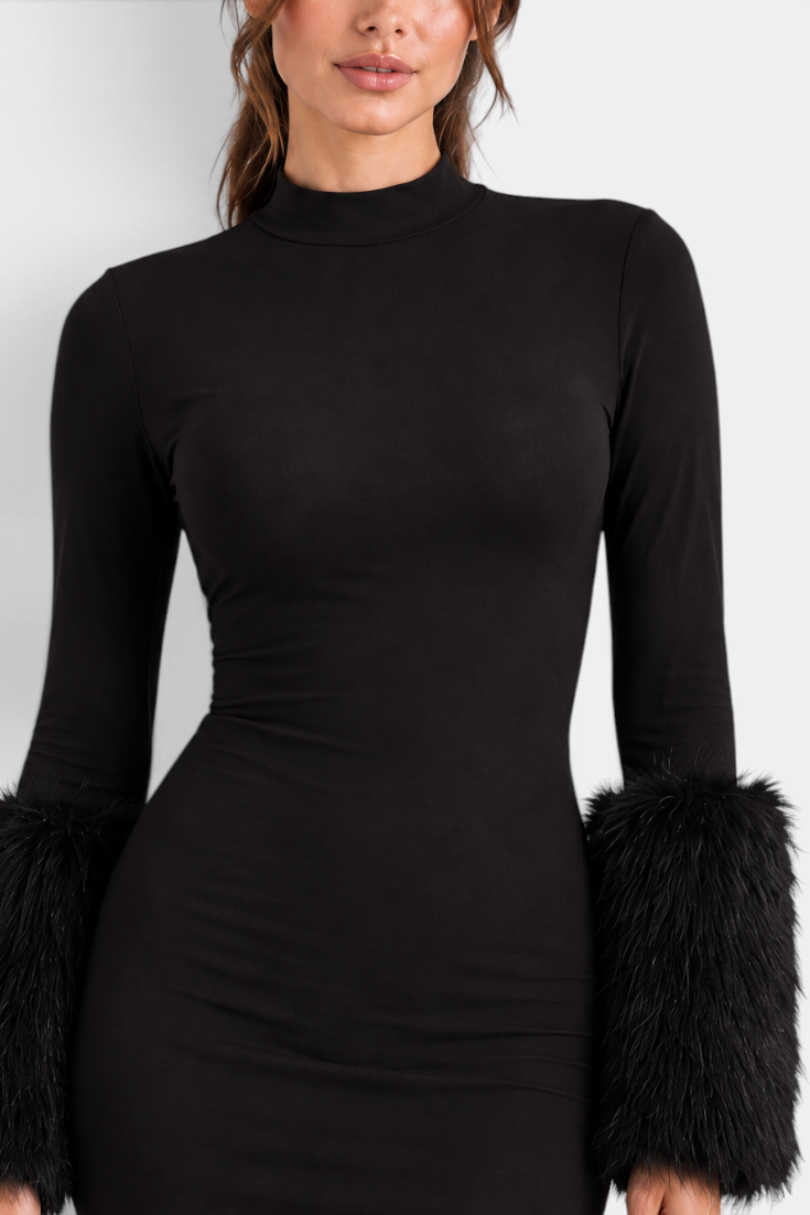 Mahaute Ione black fitted short dress with a high neck and long sleeves featuring glamorous faux fur cuffs.