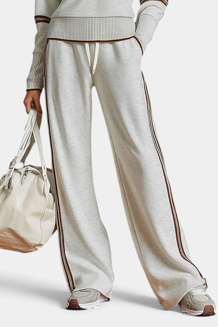 Mahaute Ismay beige knit lounge set with wide-leg trousers, contrast side stripes, and ribbed hem details