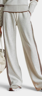 Mahaute Ismay beige knit lounge set with wide-leg trousers, contrast side stripes, and ribbed hem details