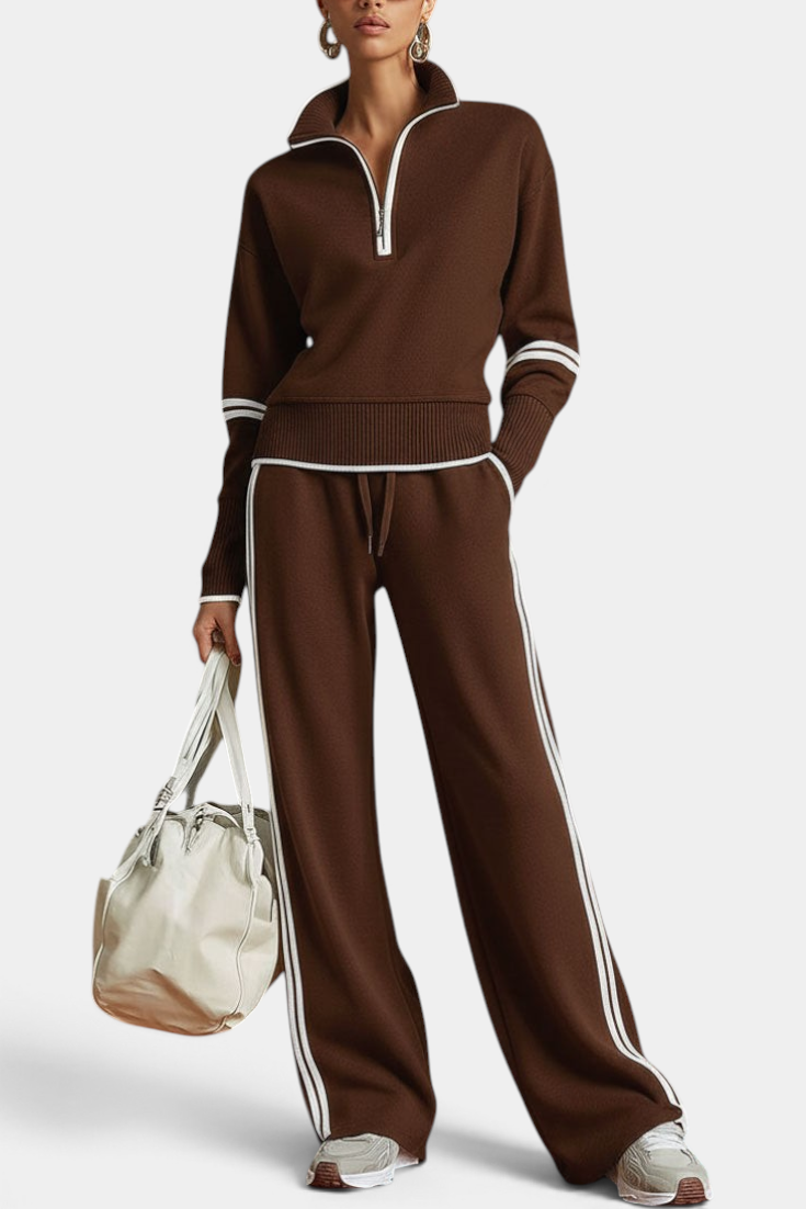 Mahaute brown knit lounge set with zip-up collar, wide-leg trousers, and white contrast stripes on a model.