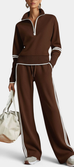Mahaute brown knit lounge set with zip-up collar, wide-leg trousers, and white contrast stripes on a model.