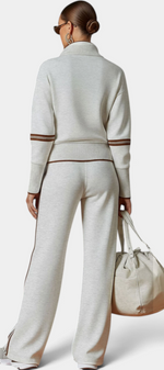 Mahaute Ismay beige knit lounge set with zip-up collar, ribbed cuffs, and brown contrast side stripes on back view.