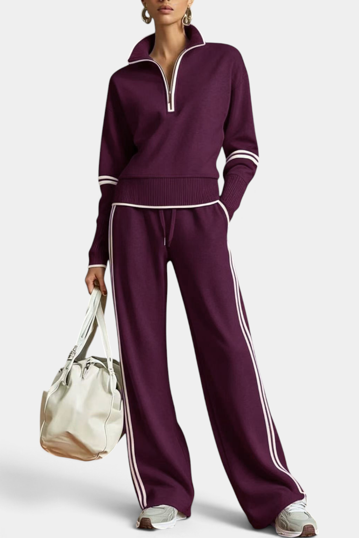 Mahaute Ismay plum knit set with zip-up collar, wide-leg trousers, and white contrast stripes on a model.