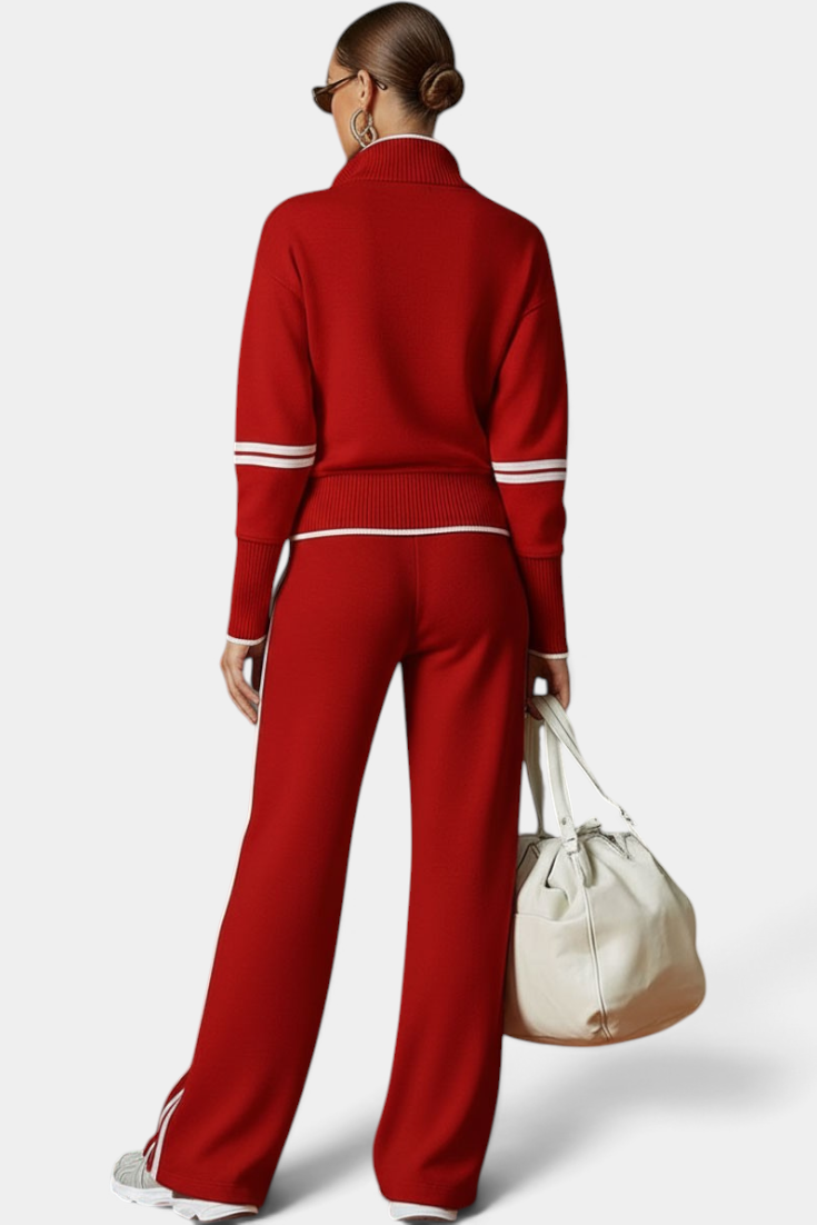 Mahaute Ismay red knit lounge set with zip-up collar, ribbed cuffs, and white side stripes on pants and sleeves