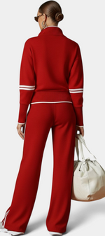Mahaute Ismay red knit lounge set with zip-up collar, ribbed cuffs, and white side stripes on pants and sleeves