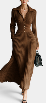 Mahaute Jessamine long brown ribbed knit dress with shirt collar, cinched waist, and gold buttons on a model.