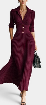 Mahaute Jessamine long burgundy ribbed knit dress with shirt collar, cinched waist, and gold buttons on a model