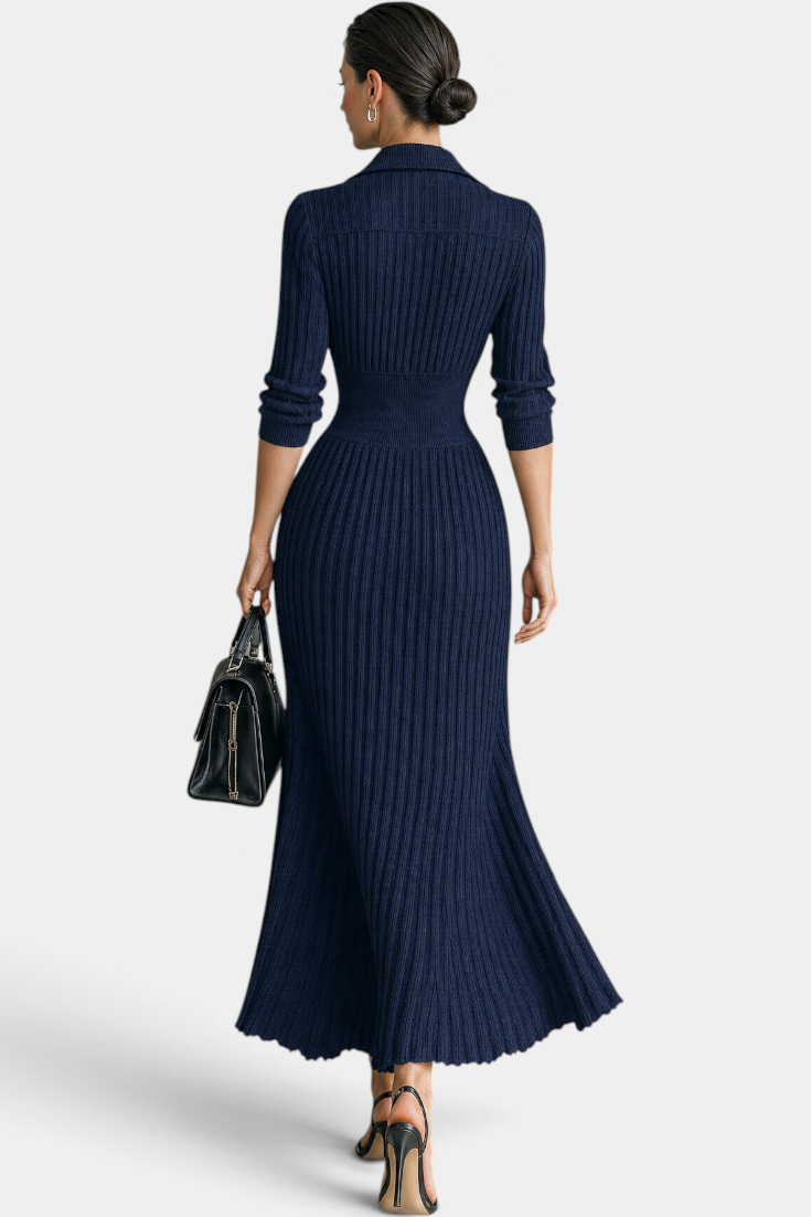 Mahaute Jessamine long navy blue ribbed knit dress with shirt collar and cinched waist, back view on a model.