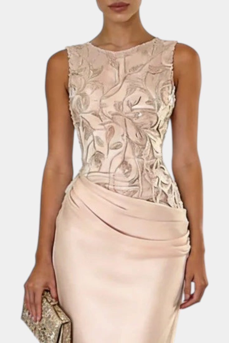 Mahaute Joni sleeveless evening gown with a floral embroidered bodice and a draped satin skirt in champagne beige.