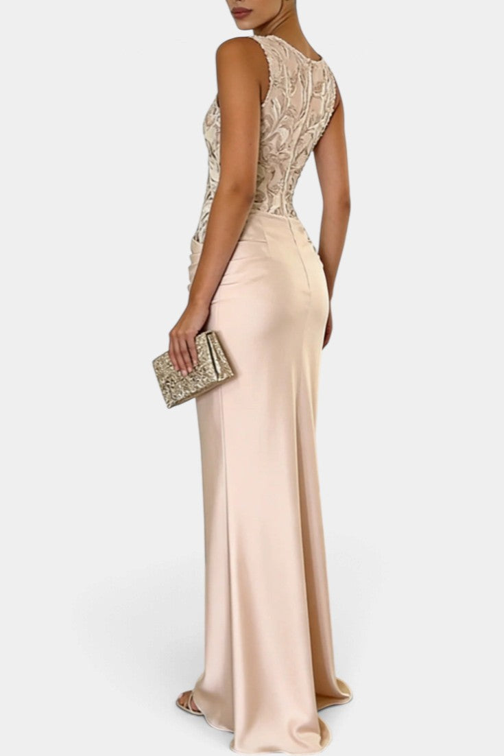 Mahaute Joni long satin evening gown with floral embroidered bodice, draped waist, and sleeveless silhouette.