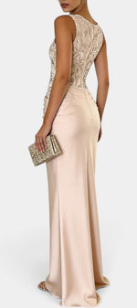 Mahaute Joni long satin evening gown with floral embroidered bodice, draped waist, and sleeveless silhouette.
