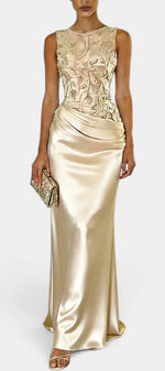 Mahaute Joni sleeveless floor-length gown featuring a champagne satin skirt and a floral embroidered bodice.