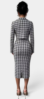 Back view of a Mahaute Kalina midi dress and blazer set in a black and white houndstooth pattern on a model.