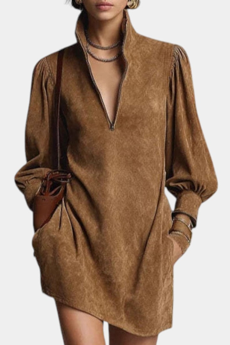 Mahaute Karoly short brown faux suede dress with a zip-up mock neck, puff sleeves, and side pockets.