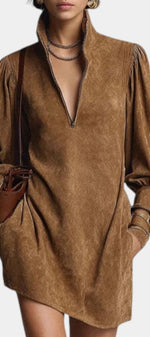 Mahaute Karoly short brown faux suede dress with a zip-up mock neck, puff sleeves, and side pockets.