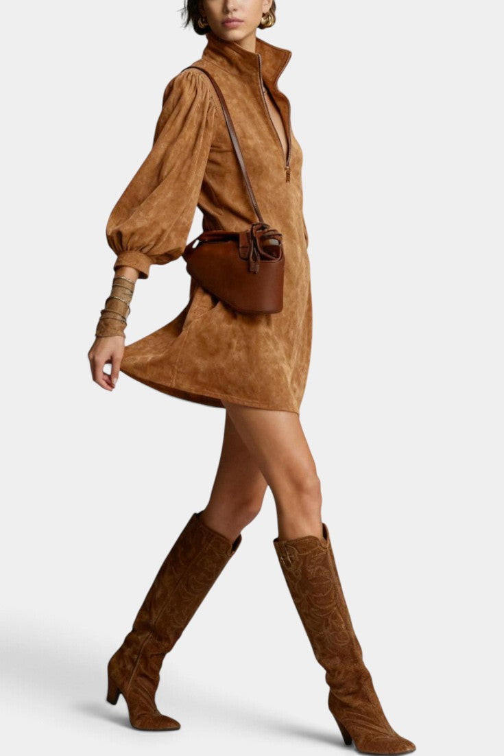 Mahaute Karoly short brown faux suede dress with zip collar, puff sleeves, and side pockets worn with tall boots
