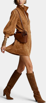 Mahaute Karoly short brown faux suede dress with zip collar, puff sleeves, and side pockets worn with tall boots