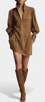 Mahaute Karoly short brown suede-effect dress with a zip-up mock neck, puff sleeves, and side pockets on a model.