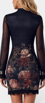 Back view of Mahaute Kessy short floral dress with high neck, sheer long sleeves, and delicate lace trim details.