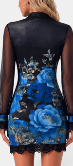 Back view of Mahaute Kessy short floral dress with black sheer sleeves, high collar, and delicate lace trim.