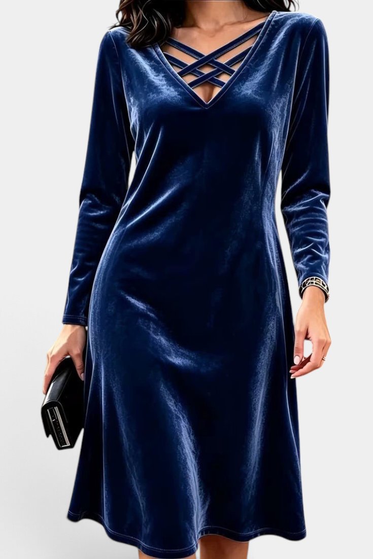 Mahaute Korréline short navy blue velvet dress with long sleeves and a V-neck featuring decorative crisscross straps.