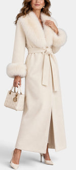 Mahaute Lalie long cream coat with faux fur collar and cuffs, featuring a belted waist and elegant tailored fit.