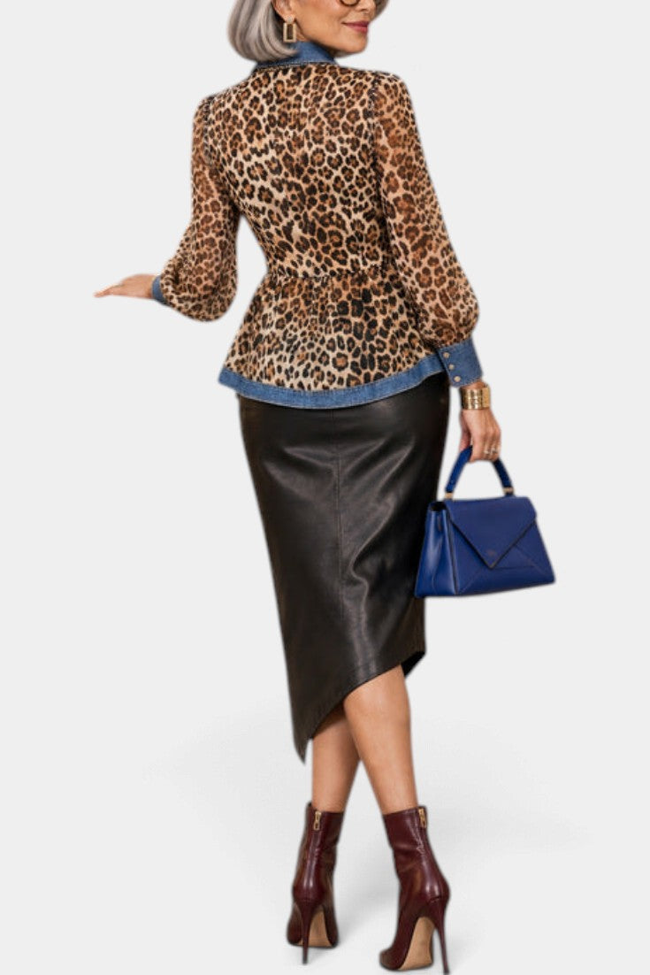 Mahaute Ashlee leopard print blouse with contrasting collar and cuffs, worn with a black midi skirt and blue handbag
