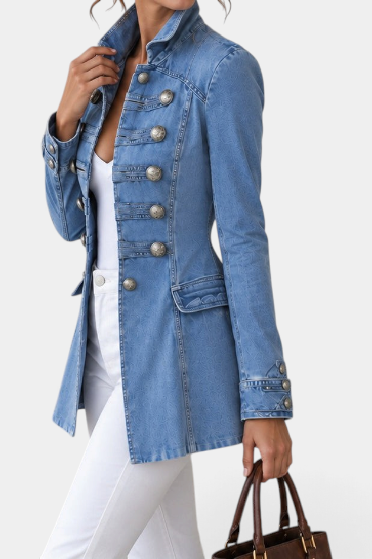 Mahaute light blue denim jacket with a high collar and ornate silver decorative buttons in a fitted military style.