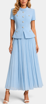 Mahaute light blue structured short-sleeve jacket with jewel buttons and matching pleated long skirt on a model