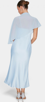Back view of Mahaute Carys midi satin dress in light blue with an asymmetrical cape and elegant draped neckline