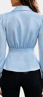 Mahaute light blue long-sleeve blouse with tailored collar, cinched waist, and gold button cuffs, back view.
