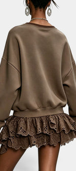 Back view of Mahaute Lilou dress featuring a brown oversized sweatshirt top and a layered lace ruffle skirt.