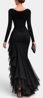 Mahaute long black evening gown with draped neckline, long sleeves, and asymmetrical ruffled skirt, back view.
