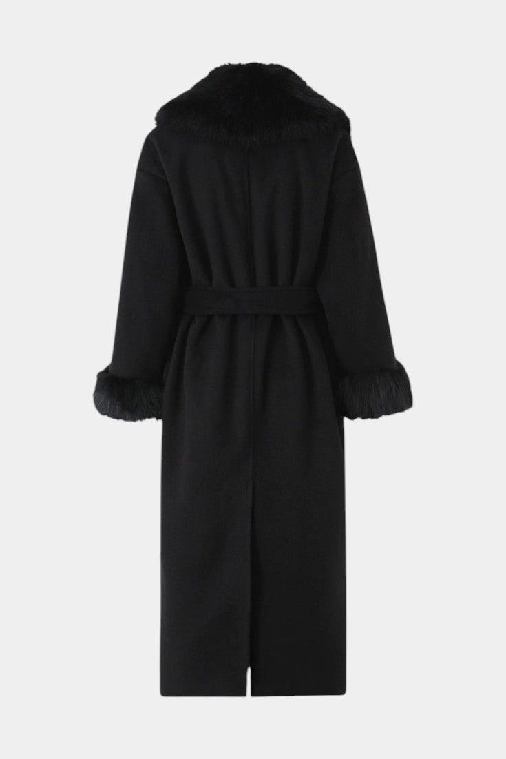 Back view of Mahaute Lalie long black coat with faux fur collar and cuffs and a waist-cinching tie belt