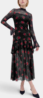 Robe longue Mahaute à imprimé de roses, manches transparentes et volants, élégante et fluide en tissu léger.