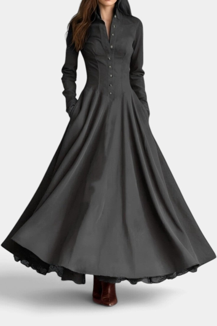 Mahaute Maravilla long black faux suede shirt dress with a structured collar, button-down front, and flared skirt.