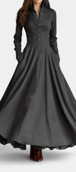Mahaute Maravilla long black faux suede shirt dress with a structured collar, button-down front, and flared skirt.