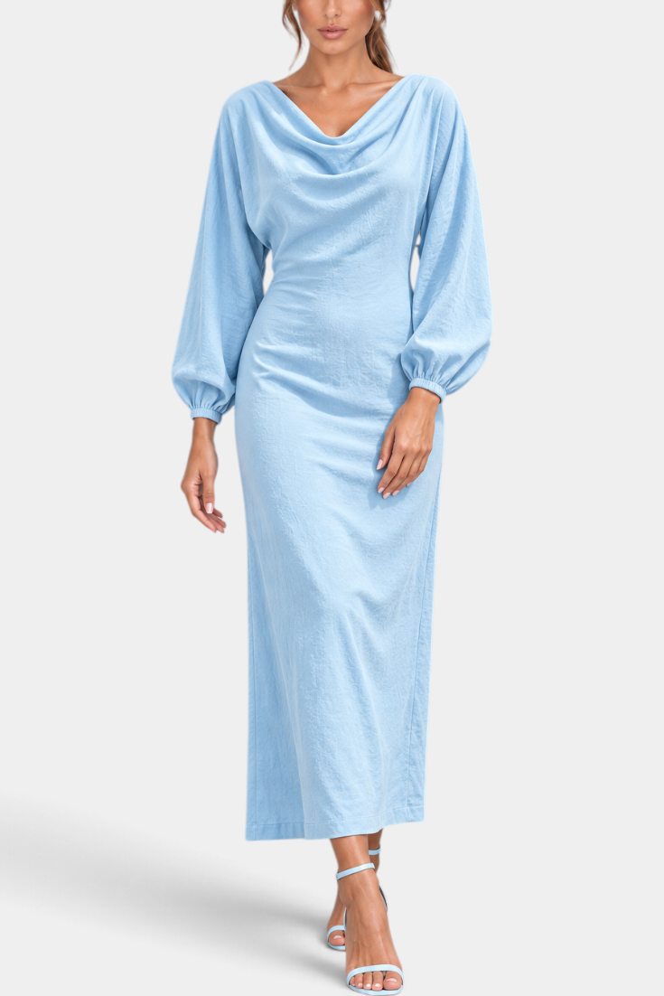 Mahaute Nicole long light blue dress with draped cowl neck, balloon sleeves, and a fitted waist on a model.