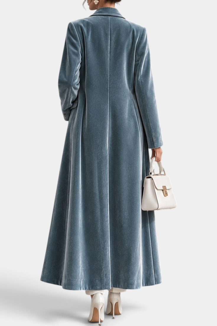 Mahaute long blue velvet coat with elegant lapels, shown from the back, featuring a tailored fit and floor-length hem.
