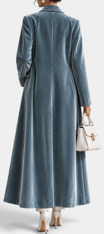 Mahaute long blue velvet coat with elegant lapels, shown from the back, featuring a tailored fit and floor-length hem.
