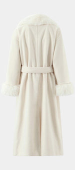 Back view of Mahaute Lalie long cream coat with faux fur collar and cuffs and a belted waist