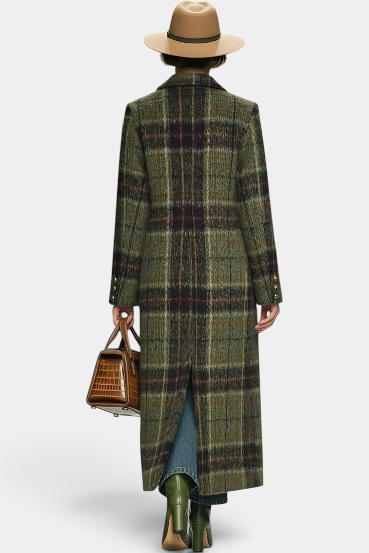 Back view of a model wearing a Mahaute long structured plaid coat in olive green with a brown hat and handbag.