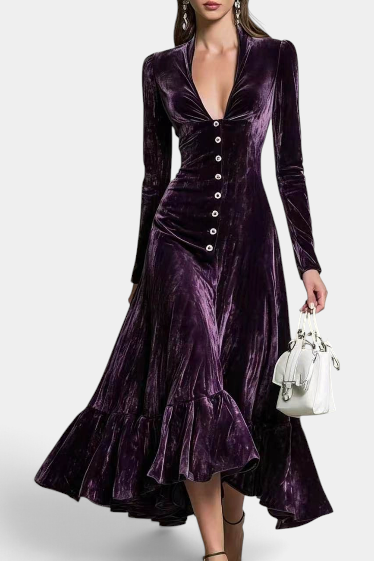 Mahaute Lorya midi dress in deep purple velvet with a V-neck, front buttons, and an asymmetrical ruffled hem.