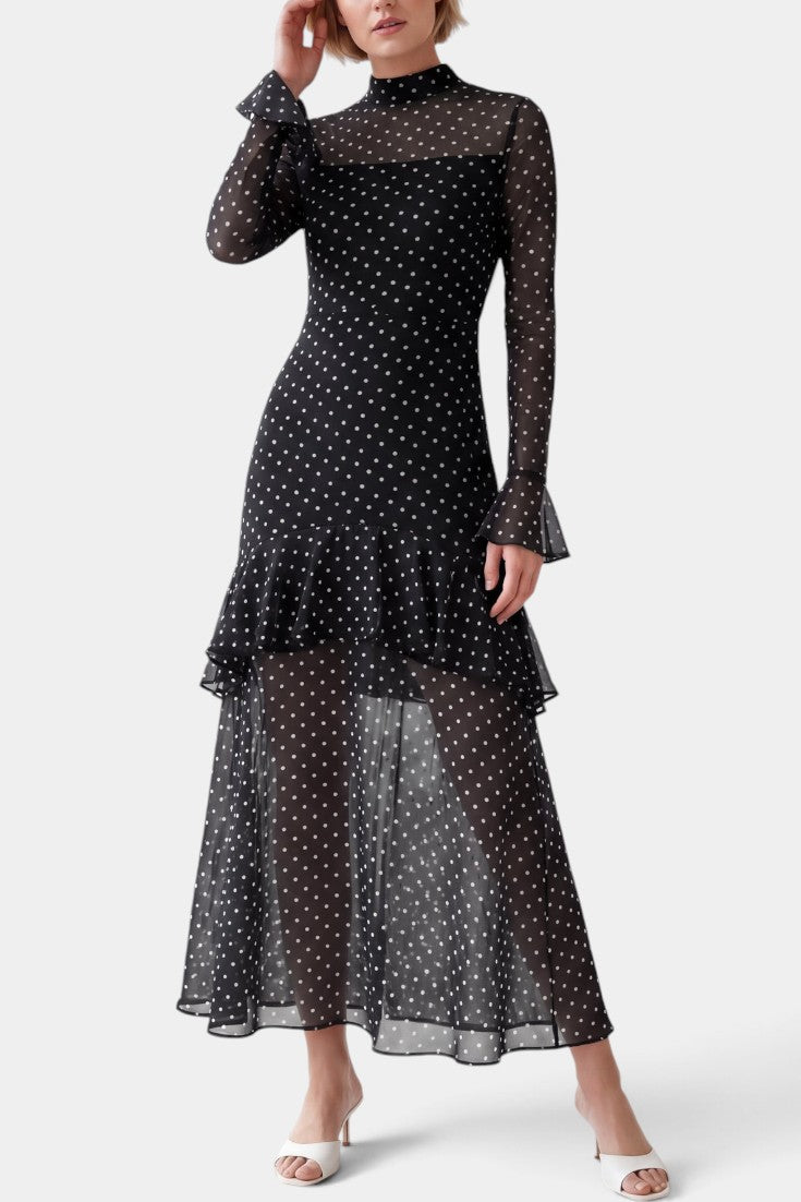 Robe longue Mahaute Lutgarde à pois noirs, col montant, volants transparents, élégante et féminine.