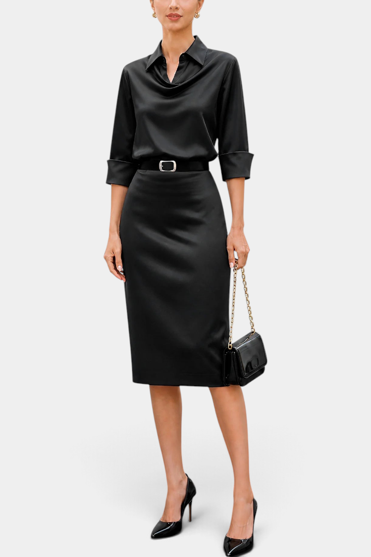 Mahaute Macarena black satin midi dress with shirt collar, draped bodice, belted waist, and long sleeves.