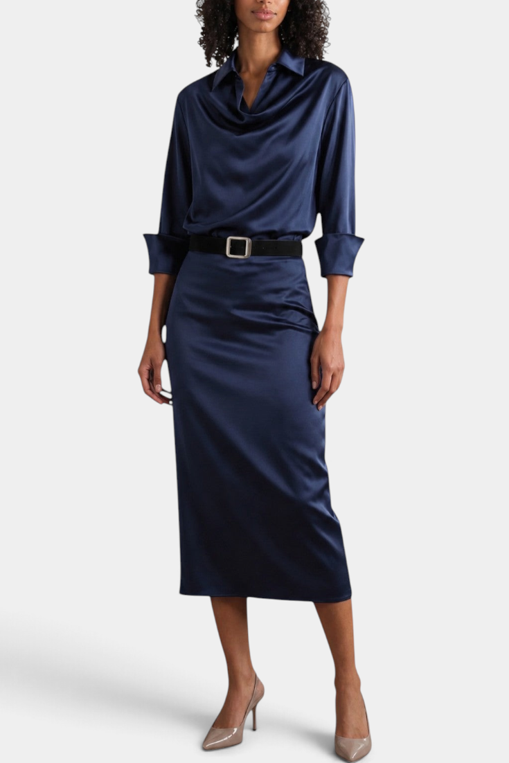 Mahaute Macarena navy blue satin midi dress with shirt collar, draped bodice, and square buckle belt on a model