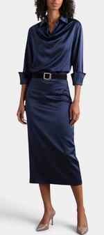 Mahaute Macarena navy blue satin midi dress with shirt collar, draped bodice, and square buckle belt on a model